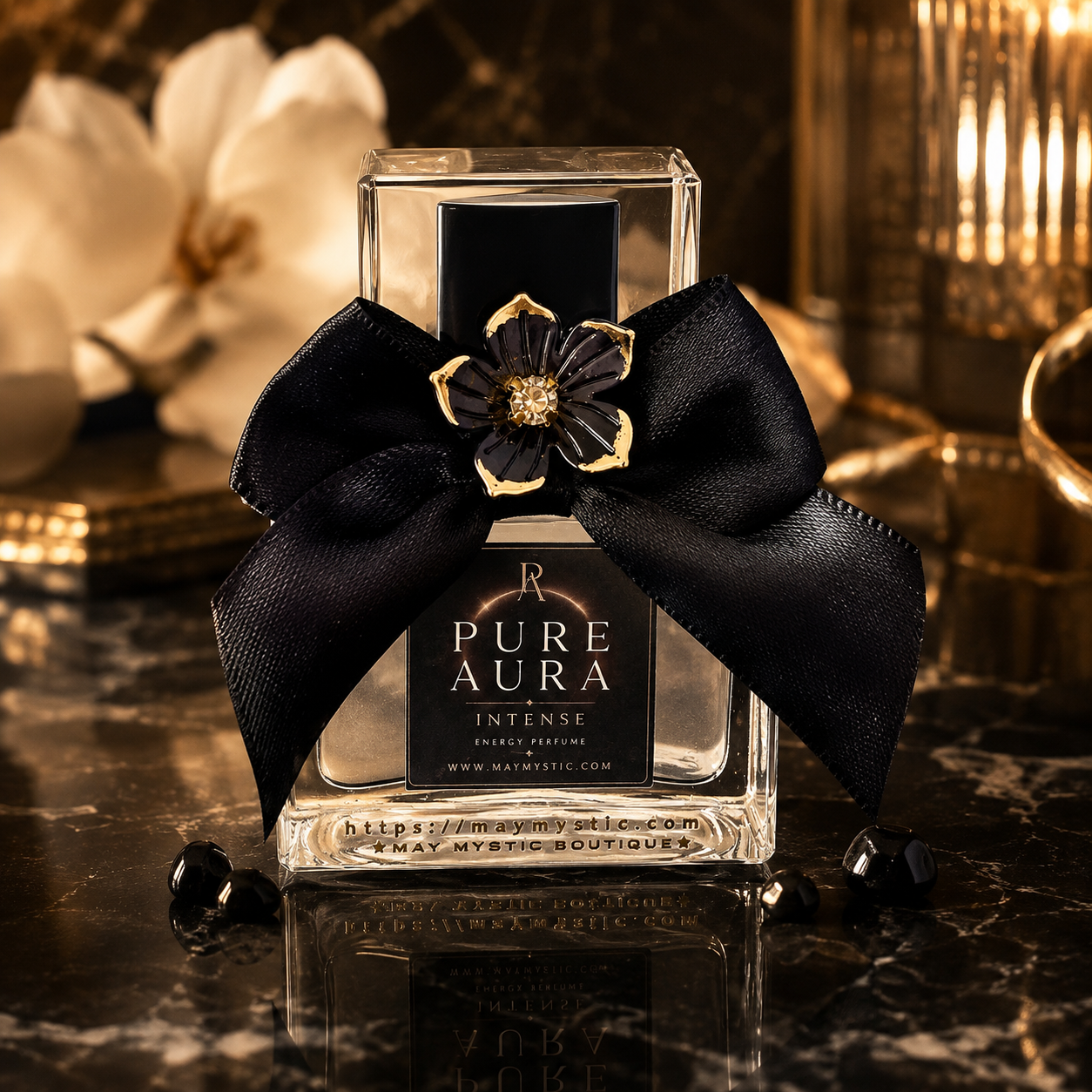 בקבוק בושם Pure Aura Intense עם סרט שחור וקשת וסמל פרח מוזהב